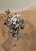 Curiosity-mönkijä laskeutuu Marsiin.  