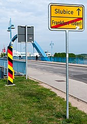 Border post and place name sign at the city bridge Frankfurt (Oder)