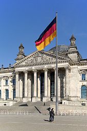 Flag of Unity in front of the seat of the German Bundestag in the Reichstag building in Berlin, hoisted as a memorial on 3 October 1990
