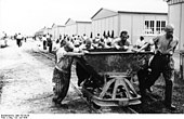 Concentration Camp Prisoners Doing Forced Labor in the Camp (Pushing Trolleys) (July 20, 1938) . 
