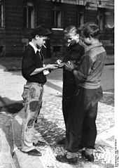 Young people trading cigarettes on the black market, West Germany 1948