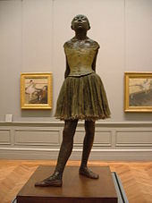 Fourteen-year-old dancer , bronze casting from 1922 after the original sculpture from 1878, bronze, partly painted, with tulle skirt and satin ribbon, height with base 105 cm