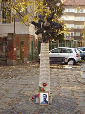 The sculpture Golden Eleven by Márton Kalmár in Szeged - with flowers, candles and a memorial picture Puskás is remembered on the day after his death.
