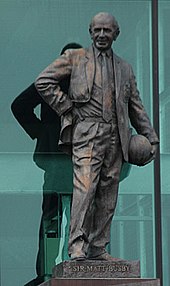 Statue of Sir Matt Busby in front of the East Stand