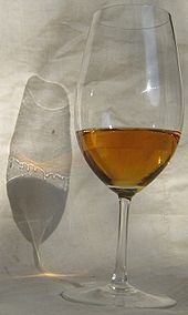 The Marangoni effect causes the tears of wine, which are clearly visible here in the shadow of the wine glass.