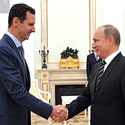Assad met Vladimir Poetin.  