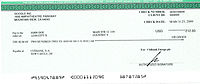 Et eksempel på en check på 212 $ udstedt til "John Doe".
