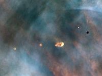 Vista de vários "proplyds" na Nebulosa de Orion tomados pelo Telescópio Espacial Hubble