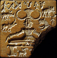 The "Mohenjo-Daro Seal 420" from the heyday of the Bronze Age Indus civilization, the central figure shows an ithyphallic figure on a throne in a sitting posture with the heels touching and the toes pointing downwards.