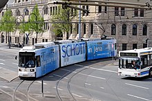 Tram (tram) and bus in Jena at Paradies