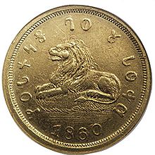 Kepingan emas 1860 $5, dengan tulisan, "Kekudusan bagi Tuhan" ( "𐐐𐐄𐐢𐐆𐐤𐐝 𐐓𐐅 𐐜 𐐢𐐃𐐡𐐔") dalam alfabet Deseret