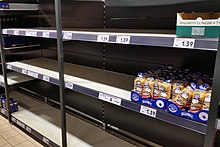 Almost empty pasta shelf in a supermarket, March 2020