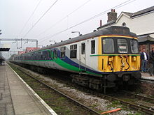 Een First Great Eastern Class 312 met de nummers 312718 en 312721 bij het station van Kirby Cross.  