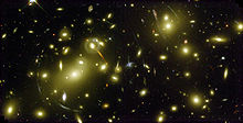 Far away galaxies appear as segments of a circle, here Abell 2218