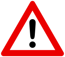 Trafikskyltar som är triangulära med röd kant varnar förare för något farligt. Den här skylten har bara ett utropstecken, så det kan vara fråga om vilken fara som helst.  