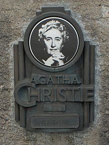 Plaque with photo in honour of Agatha Christie on the outside wall of Torre Abbey in her birthplace Torquay