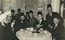 A reception of Islamic revolutionary personalities in Cairo in 1947. The photograph shows, among others, Hasan al-Bannā, Aziz Ali al-Misri, Mohamed Ali Eltaher and other Egyptian, Algerian and Palestinian representatives.