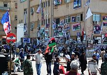 The courthouse square in Benghazi served as a central meeting and rally point. The walls are hung with photos of the fallen, with mourners constantly passing by - April 2011.