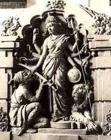 Historical photo of an Indian temple sculpture of the Hindu goddess Bhavani handing over her sword to Shivaji