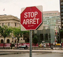 English-French stop sign at the Colline du Parlement in Canada's capital Ottawa