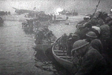 British soldiers in lifeboats on the beach near Dunkirk, 1940 (Film scene from Divide and Conquer (1943) by Frank Capra.)