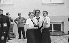Propaganda photo and propaganda campaign: BDM women leaders visit the camp (1936)