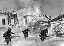 German soldiers fighting around a burning village in Norway, 40 km west of Lillehammer, April 1940.