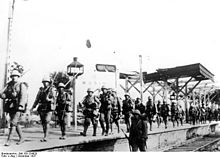 Japanese reserve on the march along the railway line to Nanjing at Wuxi station before Nanjing, December 1937