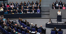 Chancellor Angela Merkel during a debate in the plenary hall of the German Bundestag, the federal government's bench on the left, 2014