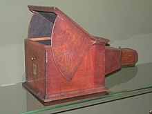 This type of camera obscura was used as a sketching instrument in the 18th century. With a sheet of paper on the glass pane, the object being viewed could be copied directly.