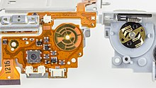 Rotary switch of a compact camera, disassembled: left the contact surfaces, right the sliding contacts