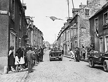 French civilians celebrate the arrival of Allied troops in Carentan, the first town liberated by U.S. troops.