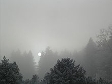 Sun penetrating through fog layer