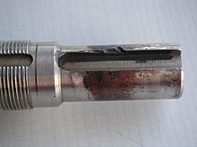Tribooxidation (fretting corrosion) on a steel shaft