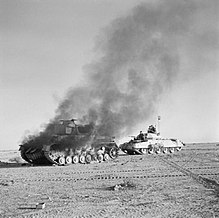 Burning German Panzer IV, British Crusader on the right (27 November 1941 during the British Operation Crusader)