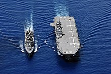 Ships of the JMSDF: A Takanami class submarine destroyer (left) with the helicopter carrier Izumo