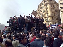 Protesters standing on an army truck in downtown Cairo on January 29, 2011.