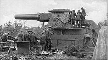 A rail-mounted 42-cm Krupp bed gun ("Dicke Bertha") is made ready for firing near Liège on August 7, 1914