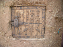 Simple door of the Dogon in Mali with a lock for access to a storage room; the ornaments originally had an apotropaic function.
