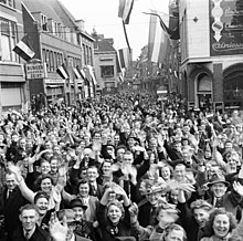 Dutch civilians cheer soldiers of the First Canadian Army in Utrecht on 7 May 1945