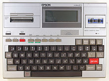 The 1982 Epson HX-20, a battery-powered handheld computer with tape drive, LCD, built-in BASIC and printer, is considered one of the first notebooks.