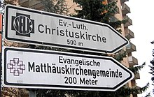 Expression of denominational diversity: signs for two different Protestant churches (one Evangelical-Lutheran and one Evangelical-United) in Wiesbaden