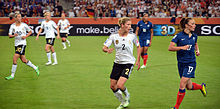 Thiney (right) and Delie (back) during the 2011 World Cup group match against Germany.