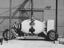 Atomic bomb "Fat Man" is loaded onto transport wagons, shortly before the flight to Nagasaki (explosive power 22 kT TNT)