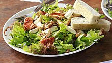 Fig salad with walnuts, lettuce, cheese and garlic bread