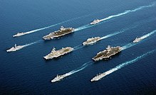 Warships of different nations in parade formation