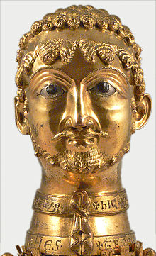 The Cappenberg Barbarossa head was probably made around 1160. It is carried by angels kneeling on an octagonal battlement. The bust came into the possession of Cappenberg Abbey during Barbarossa's lifetime. Count Otto von Cappenberg was Barbarossa's godfather in 1122. The donation of the bust to the monastery is mentioned in his will. Since Friedrich Philippi's comments published in 1886, the bust has been regarded - not without contradiction - as a representation of Barbarossa. Cappenberg, Catholic parish church.