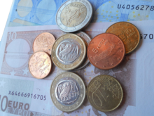 Euro bills and Greek euro coins