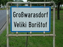 Cartel bilingüe de la ciudad (alemán-croata)