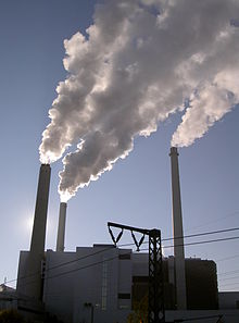 Steam-containing flue gases above industrial chimneys (CHP plant north near Munich)